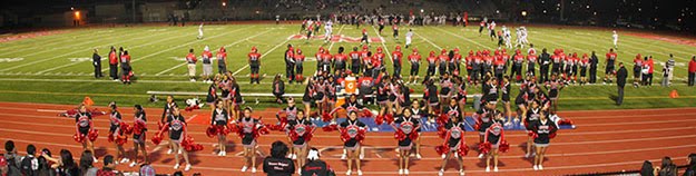 Cheerleaders cheering during a football game